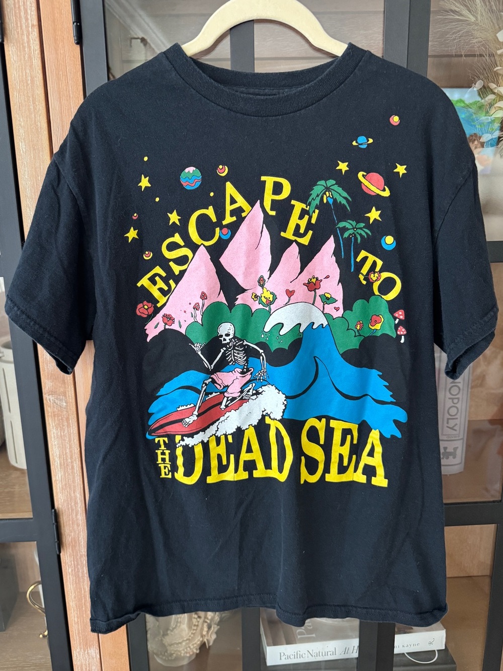 Altru Escape To The Dead Sea graphic tee skeleton surfing trippy waves colorful